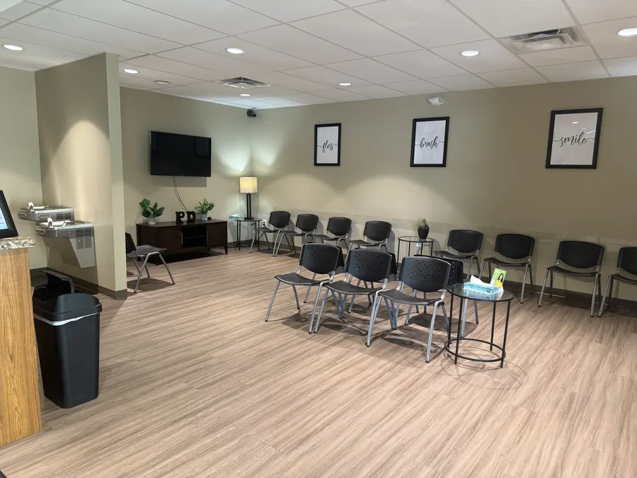 The waiting room with its hydration station and TV